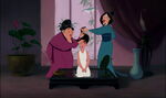 Hairdressers hairstyling Mulan's hair