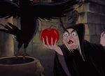 The Queen mockingly offering the apple to the raven.