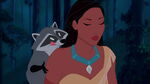 Meeko looking at Pocahontas's necklace