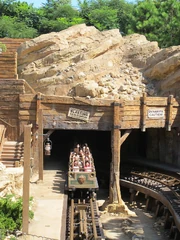 Big Grizzly Mountain Runaway Mine Cars blasting out of the mine.