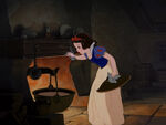 Snow White cooking dinner for the dwarfs