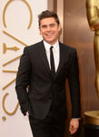 Zac Efron arrives at the 86th annual Academy Awards in March 2014.