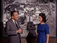 Walt and Julie in front of a map of Disneyland