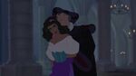 Frollo sneaks up behind Esmeralda and forcefully grabs her arm.