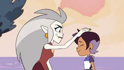 Eda gives Luz a pat on the head