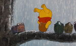 Winnie the Pooh has his head stuck in his honey pot