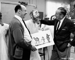 Marc Davis and Walt Disney with an animatronic for Pirates of the Caribbean.