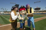 Jake stands between Sharky and Bones at Dodger Stadium
