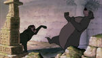 Bagheera angrily steps on Baloo's foot