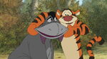 Tigger is making Eeyore smile