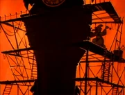 Vlcsnap-2015-08-15-12h12m07s689.png (408 KB) Zorlock constructing the Doomsday Clock in a flashback from "A Knight to Remember"