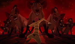 Timon facing off with the hyenas.