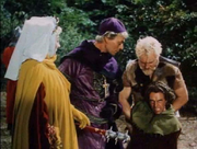 The Queen and the Archbishop finding out the truth behind the deception; thanks to Little John