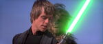 Luke with his green-bladed lightsaber.