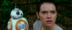 Rey and BB-8 gaze in horror at a swarm of First Order TIE fighters descending on Maz Kanata's castle on Takodana.