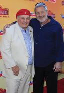 Kevin Schon with Ernie Sabella at the premiere of The Lion Guard: Return of the Roar in November 2015.