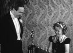 Walt being given his special Oscar by Shirley Temple.