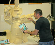 Work on the Mickey sculpture on the attraction's roof