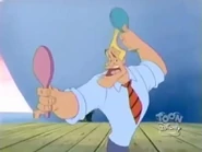 Kent admiring his own face in a mirror