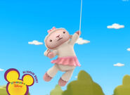 Lambie flying away with a balloon