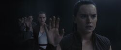 Rey sees several versions of herself reflected inside the mirror cave.