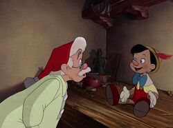 Geppetto meets the living Pinocchio for the first time.