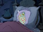 Madam Mim taking her temperature.