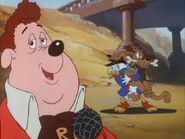 Scrooge struggling with a Pluto look-alike