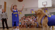 Noah playing basketball with Buddy