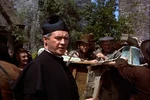 Father Murphy surprised to see something (King Brian) moving inside Darby's sack
