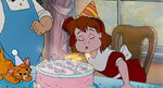 Jenny blowing her eight birthday candles