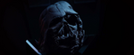 Kylo Ren gazes at the mask of Darth Vader.