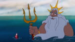 King Triton, having had a change of heart about humans, and understanding Ariel's wishes, turns her into a human