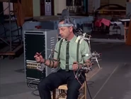 Rogers demonstrating how they record and program the animatronics movements.