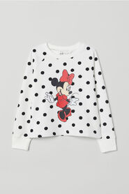 Sudadera estampada con mangas raglán largas de H&M.