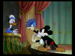 Mickey showing donald cards