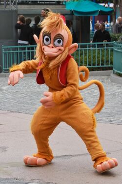Abu posing for a photo at Disneyland Paris.