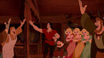 The Bimbettes, alongside the other tavern patrons, cheering Gaston on as he leaves to conduct his plot.