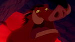 Pumbaa preparing to save Timon and Zazu from Shenzi, Banzai, and Ed