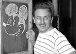 A young Walt Disney drawing Mickey.