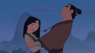 Mulan and Shang laughing about the necklaces getting caught with each other