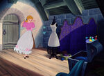 Cinderella shows the dress to her animal friends.