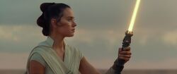 After burying the Skywalker sabers on Tatooine, Rey ignites the new lightsaber that she constructed herself.