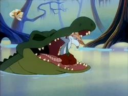 Boudreaux struggling to free himself from the alligator.