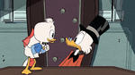 Scrooge crowded around by his nephews