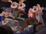 Dopey cheers when Snow White chooses to stay.