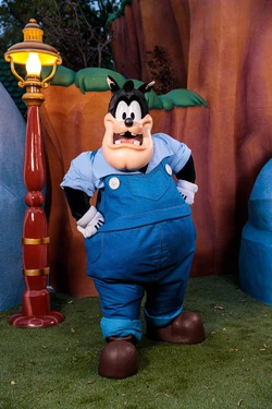 Pete, in his new modern design, posing for a photo in Mickey's Toontown at Disneyland.