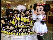 Minnie setting up the Mickey Mouse plushies