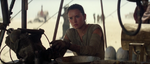 Rey gazes longingly at the ship, wishing to leave the planet herself.