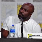 Mike Colter speaks at the 2019 San Diego Comic Con.